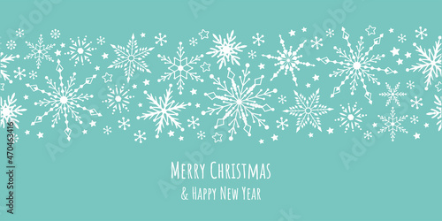 White snow falling on blue sky. Seamless background pattern. Snowflakes design for christmas greeting card banner od package