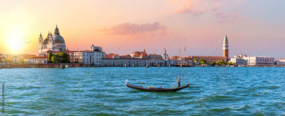 Panoramic view of Venice lagoon and gondola at sunset, Italy