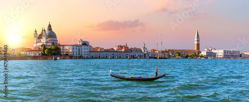 Panoramic view of Venice lagoon and gondola at sunset, Italy