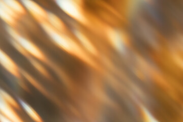 Blur glow overlay. Bokeh rays. Sunlight beam glare. Gleam leak. Defocused golden orange black light flecks on dark abstract background.