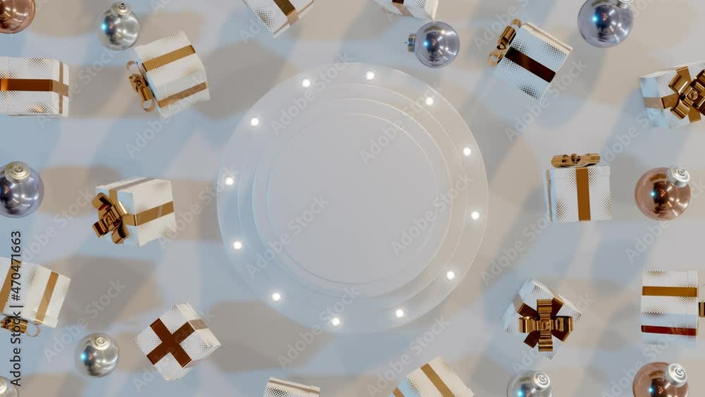 White gift boxes tied with a gold ribbon rotate around the illuminated ...