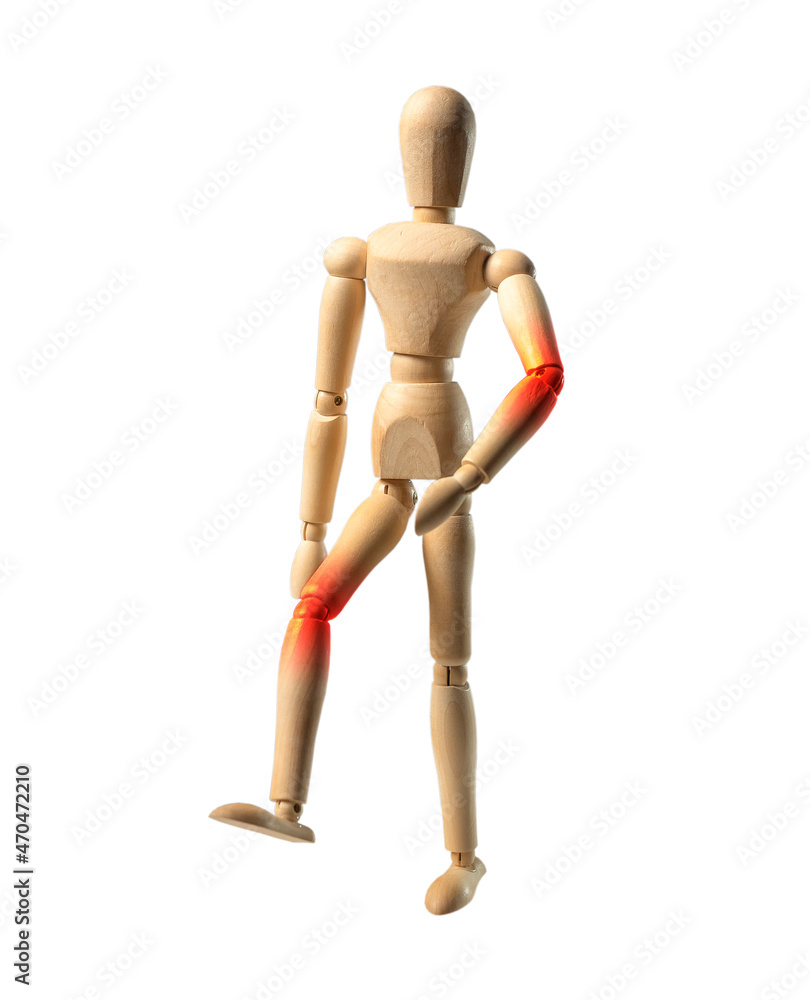 Joints ache concept. Wood doll person walking with pain in elbow and knee. Wood mannequin in motion, going.