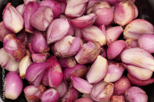 Pile of peeled red onions