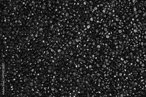 Many black and gray granules of polypropylene, polyamide. Background. Plastic and polymer industry, industry. Microplastic products.