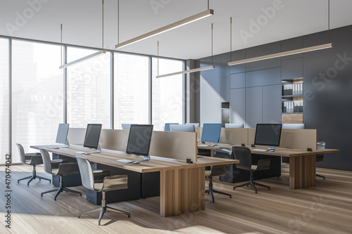 Panoramic office with grey and beige working area. Corner view.