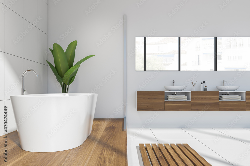 White bathroom interior with sink and white bathtub on podium White bathroom interior with sink and white bathtub on podium