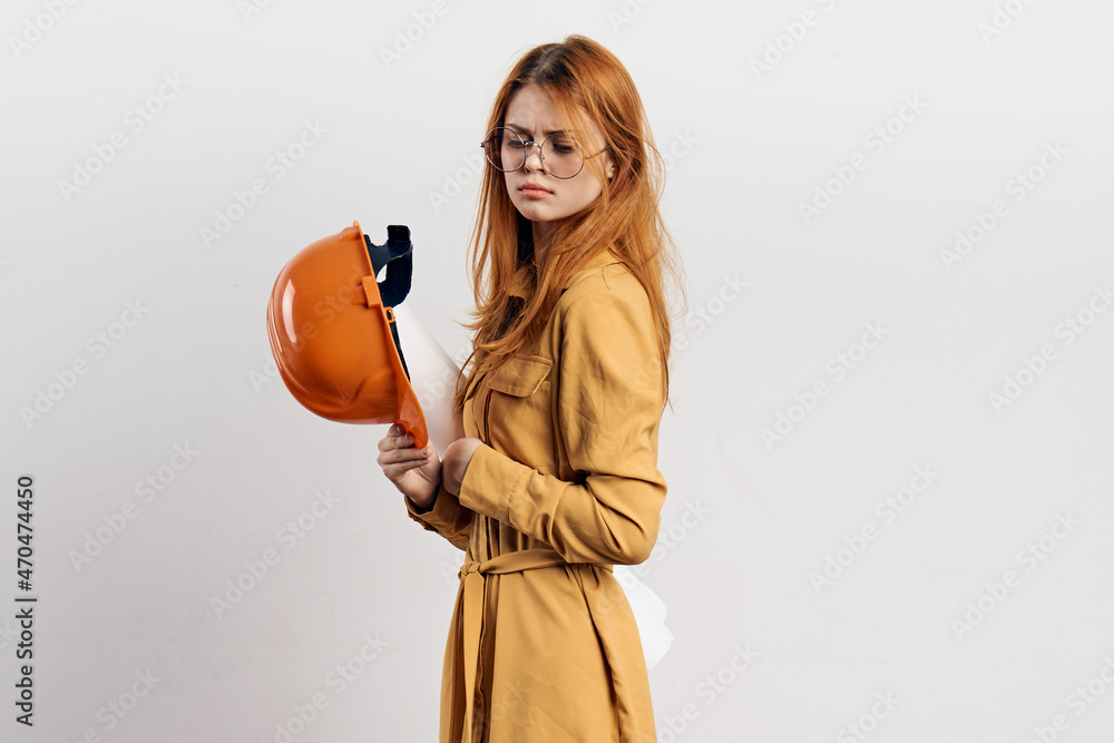 female engineer in orange hard hat blueprints architect female engineer in orange hard hat blueprints architect