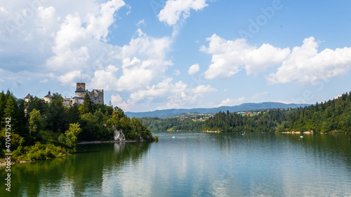 View of the castle in Niedzica with a lake © KRWfoto