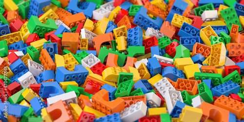 Heap of colorful toy plastic bricks and blocks