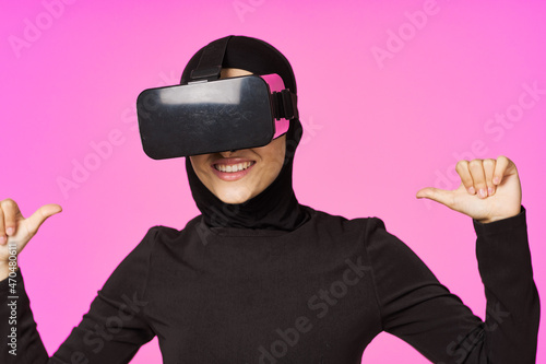 muslim woman wearing virtual reality glasses entertainment technology device