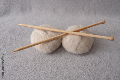 Two soft balls of alpaca silk yarn with two bamboo knitting needles