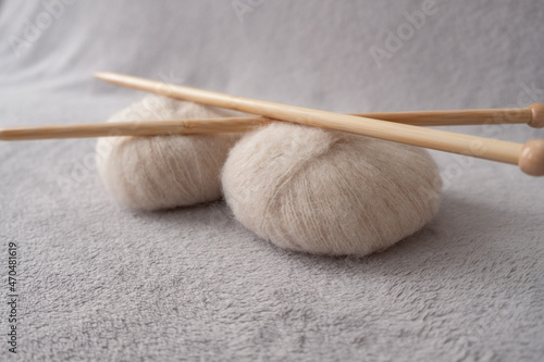 Two soft balls of alpaca silk yarn with two bamboo knitting needles