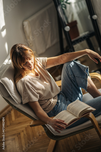 person reading a book in a cafe