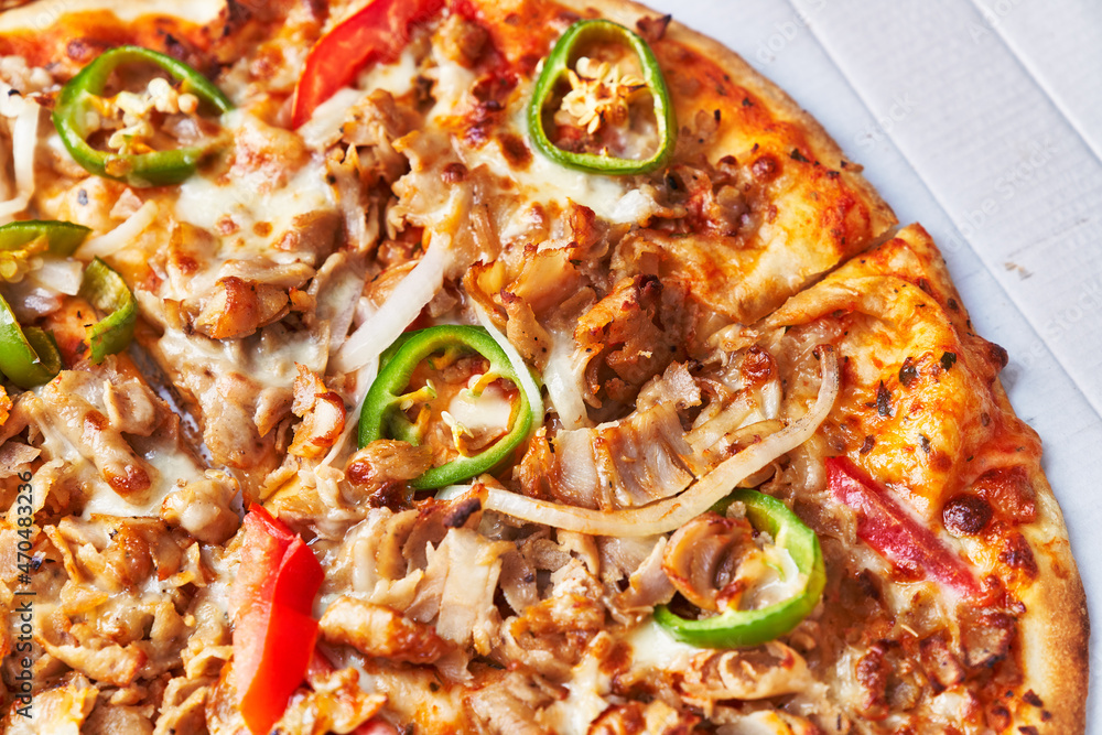 Delicious kebab italian pizza on a cardboard surface Delicious kebab italian pizza on a cardboard surface
