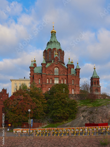 Orthodox Uspensky Cathedral in Helsinki: katajanokka, autumn, red brick, old historic building, stone, blue beautiful sky.