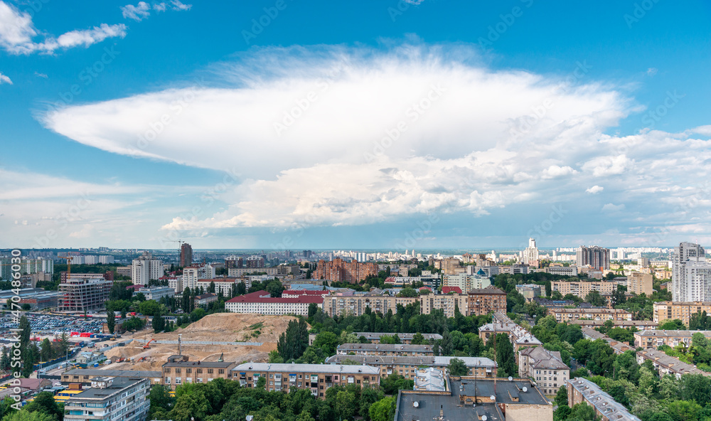 Beautiful cloud above city at summer day