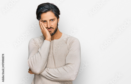 Young hispanic man wearing casual clothes thinking looking tired and bored with depression problems with crossed arms.