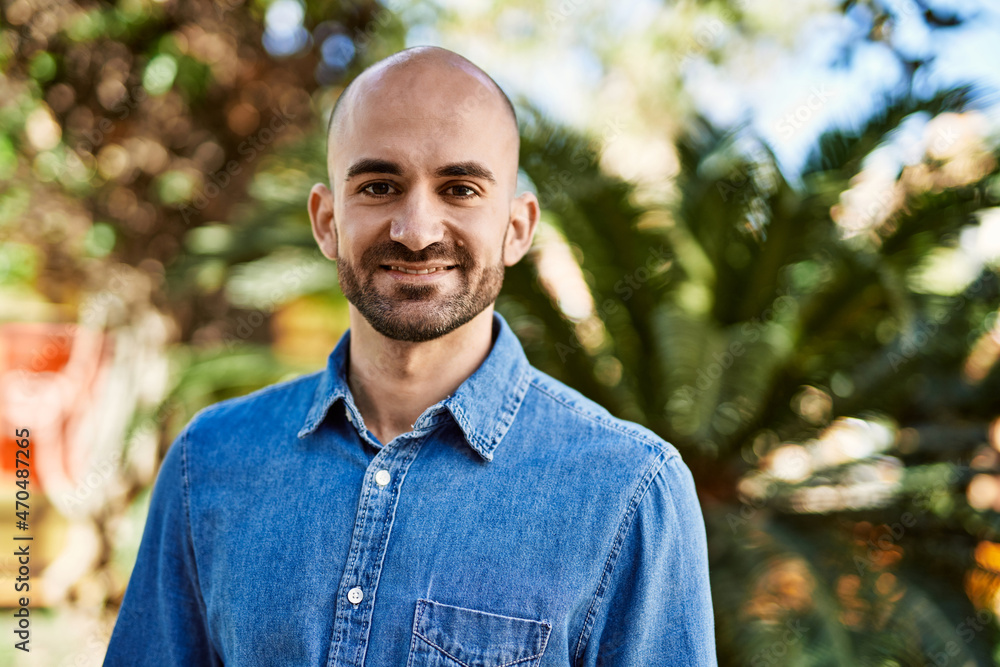 Young hispanic man smiling happy standing at the park. Young hispanic man smiling happy standing at the park.