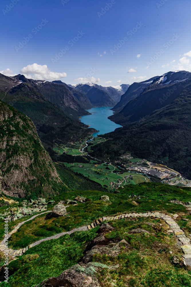 Scenic view on beautiful fjord, town and Norwegian mountains