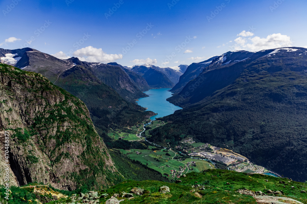 Scenic view on beautiful fjord, town and Norwegian mountains