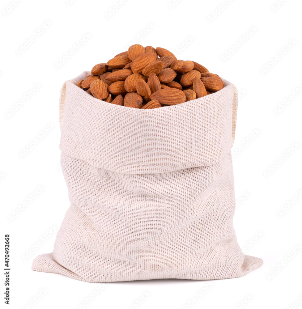 Almonds in bag from sacking isolated on white background Almonds in bag from sacking isolated on white background