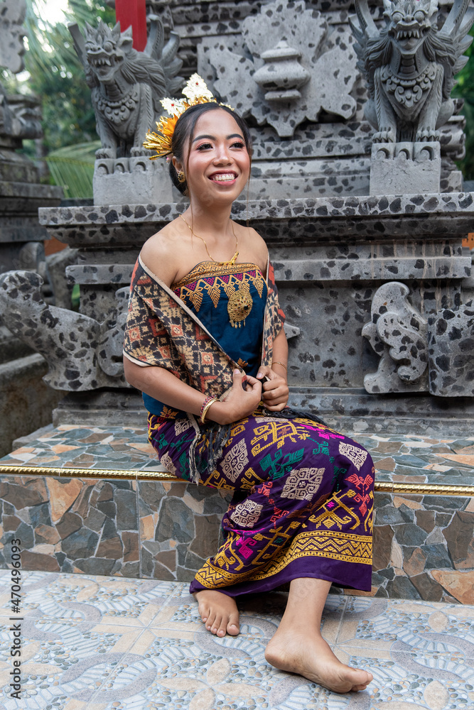 Portrait of two young girls with traditional costume with offering in ...