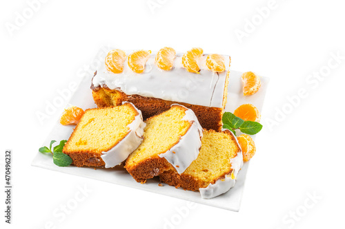 Christmas cake with tangerine sliced in a plate isolated on white background. Holiday banquet buffet dessert