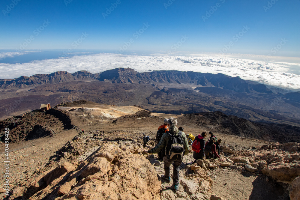Hiking and climbing in top of the mountain. Trekking experience on Teide Volcano in Canary island Tenerife. Pico del Teide climbing