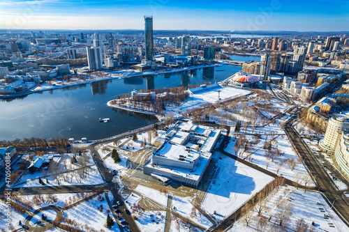 Yekaterinburg aerial panoramic view at Winter in sunny day. Ekaterinburg is the fourth largest city in Russia located in the Eurasian continent on the border of Europe and Asia. © Dmitrii Potashkin