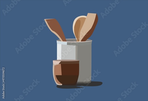 Serving spatulas in a white bowl and a brown bowl for sauces and oils.