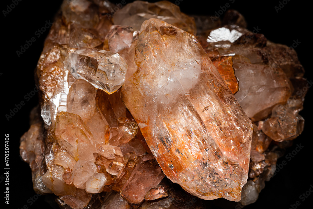 Big Quartz crystals rock in natural appearance, selective focus, found in the Caribbean river water.  Crystals cluster close-up, on black surface. The most common mineral and home decoration.