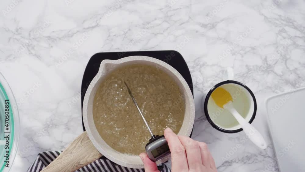 Flat lay. Step by step. Caramelizing sugar in a small cooking pot over the small electric stove. Flat lay. Step by step. Caramelizing sugar in a small cooking pot over the small electric stove.