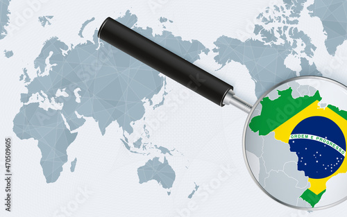 Asia centered world map with magnified glass on Brazil. Focus on map of Brazil on Pacific-centric World Map.
