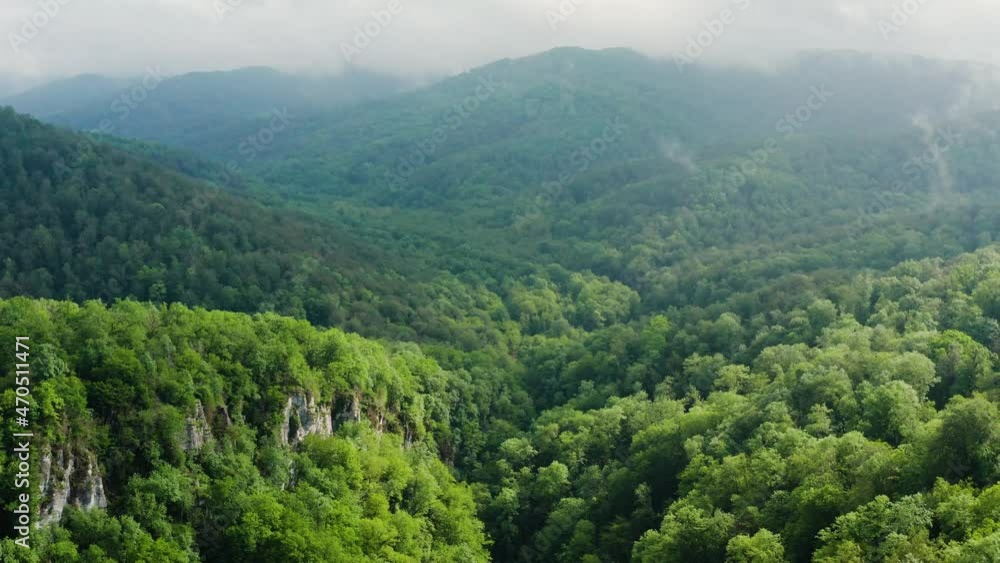 Caucasus Mountains, Akhun mountain range. Navalishinsky Canyon (White rocks). The valley of the Bolshaya Khosta River in fog. Aerial view. Caucasus Mountains, Akhun mountain range. Navalishinsky Canyon (White rocks). The valley of the Bolshaya Khosta River in fog. Aerial view.