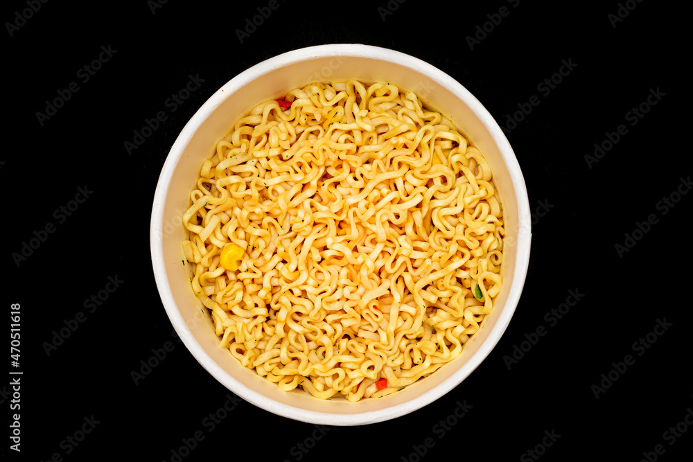 Instant Noodles in Disposable Cup on Black Background - Top View. Asian Fast Food. Quick Lunch Instant Noodles in Disposable Cup on Black Background - Top View. Asian Fast Food. Quick Lunch