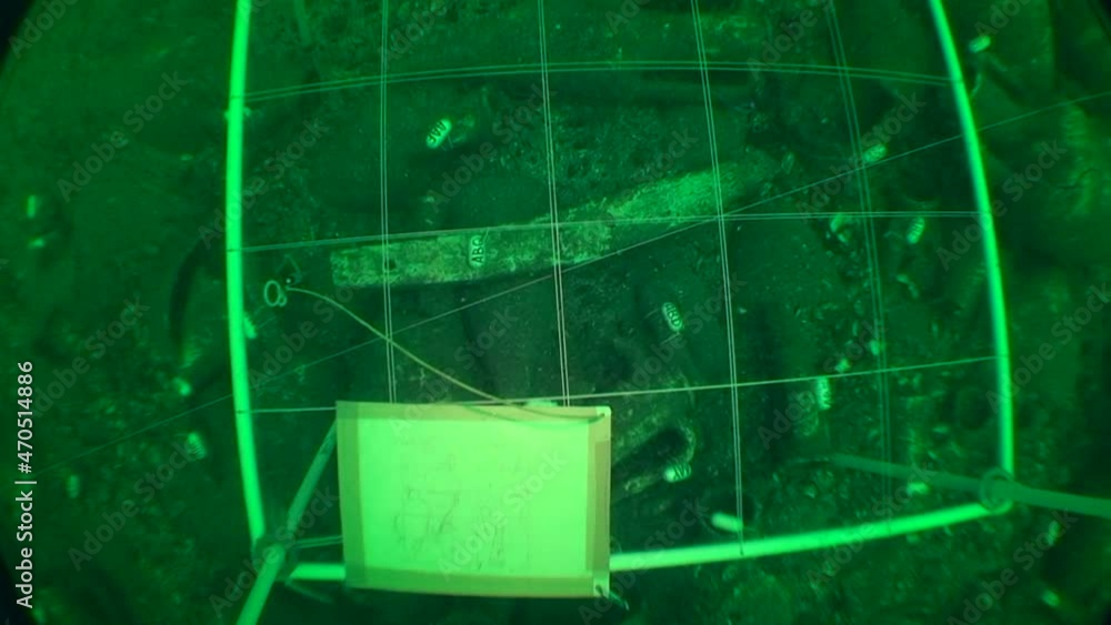 Underwater archeology sketching an underwater archaeological object