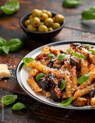 Pasta alla Norma with eggplant or aubergine, tomato, parmesan and basil. Healthy food