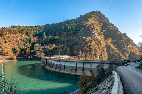 The Plastiras Dam, a concrete arch dam in Karditsa regional unit, Greece that impounds the Tavropos River, creating the artificial lake Plastiras. photo