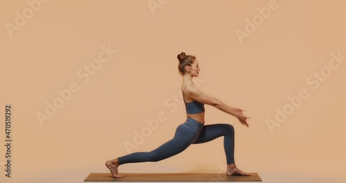 Yoga pilates stretching workout. Young fit girl exercise performing lunge pose in studio for perfect healthy body, spine