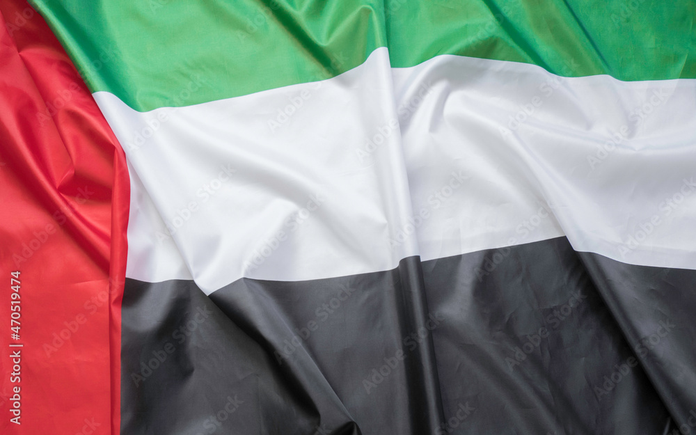 waving fabric texture of the flag with color of united arab emirates, uae real texture flag
