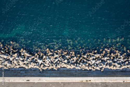 Drone view of Tetrapods on a shore in Sozopol town on the Black Sea coast in Bulgaria photo