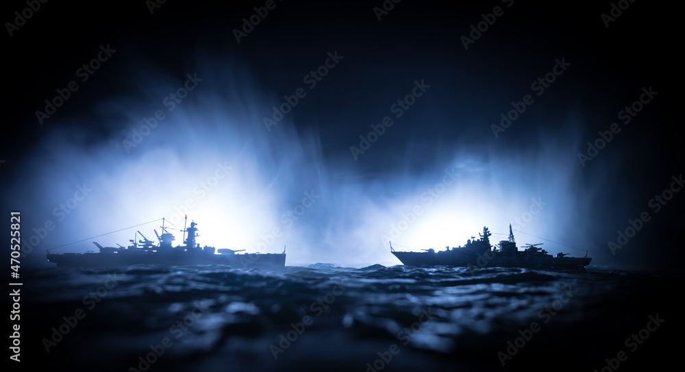 Fototapeta premium Silhouettes of a crowd standing at blurred military war ship on foggy background. Selective focus. Passengers try to escape. Protest of people