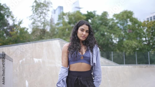 Attractive young mixed race millennial girl in New York City. Urban modern student lifestyle, hipster fashion in NYC, skater model, multi-ethnic hispanic American. skateboarder girl hipster at skatepa