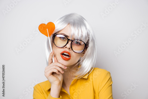cheerful glamorous woman with a lollipop in her hands model © VICHIZH