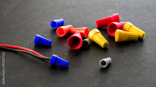 Electrical colorful wire connectors on black background