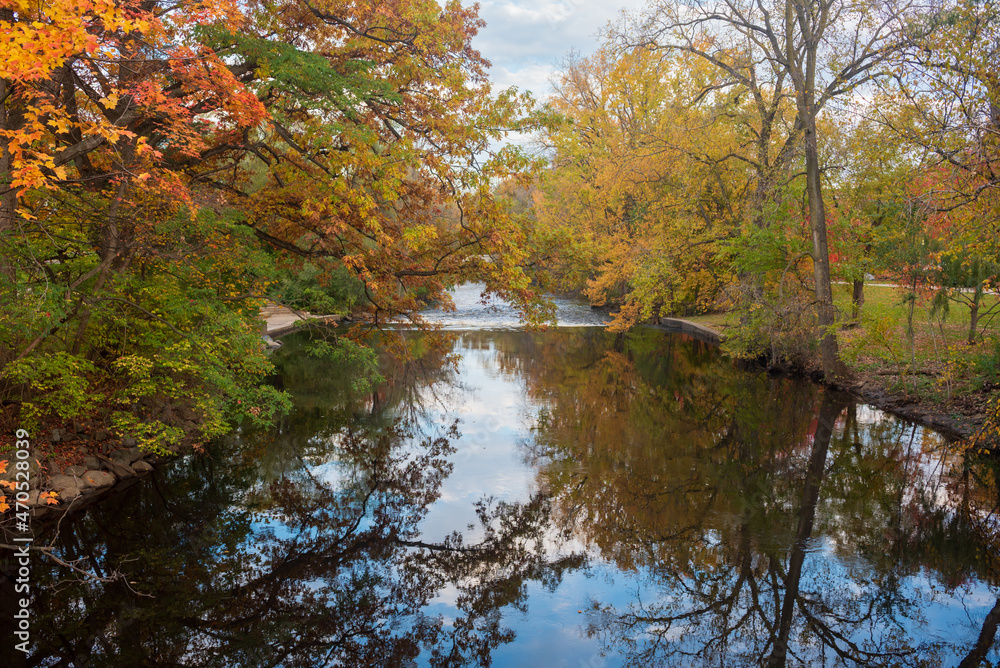 Red Cedar river winding through Michigan State University campus during the Fall