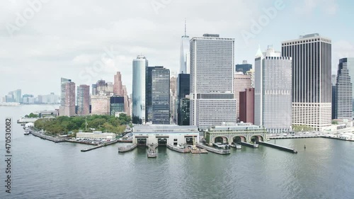South ferry terminal. Staten Island Ferry to New York City. Aerial Manhattan drone skyscrapers. NYC holidays tourists visit USA, American urban destination. 