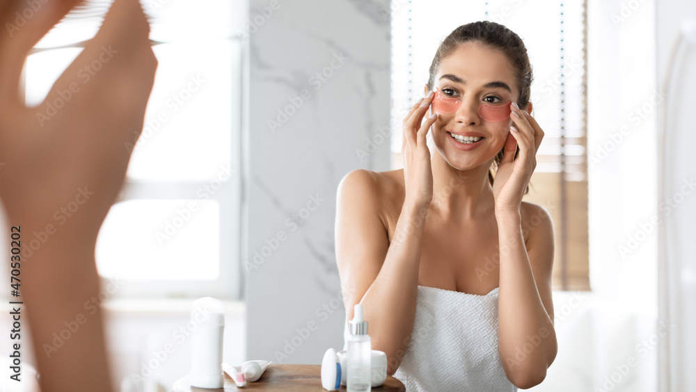 Attractive Lady Applying Patches Moisturizing Skin Under Eyes In Bathroom Attractive Lady Applying Patches Moisturizing Skin Under Eyes In Bathroom