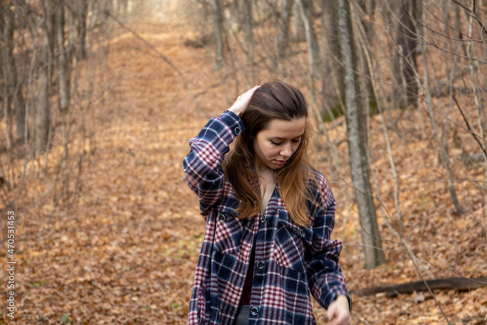 Beautiful girl in the woods near the trees Beautiful girl in the woods near the trees