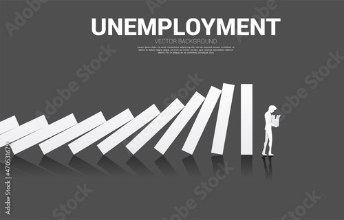 silhouette of unemployed man at the end of domino collapse. Concept of business industry disrupt.